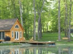 View of lake and cottage in summer